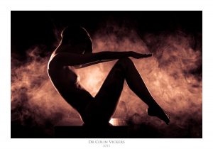 Fine Art Nude Photographer Vienna - Nude Model Poses On Box Surrounded By Smoke